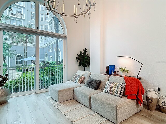 700 S Harbour Island Blvd Unit 143, Tampa, FL 33602 - living area featuring a notable chandelier, a high ceiling, and wood finished floors