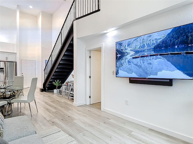 700 S Harbour Island Blvd Unit 143, Tampa, FL 33602 - interior space featuring baseboards, a high ceiling, and wood finished floors