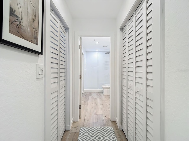 700 S Harbour Island Blvd Unit 143, Tampa, FL 33602 - corridor featuring a textured wall and light wood-type flooring