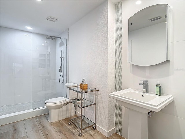 700 S Harbour Island Blvd Unit 143, Tampa, FL 33602 - full bath with visible vents, a stall shower, toilet, and wood finished floors