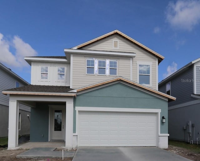 3319 Guanabana Xing, Wesley Chapel, FL 33543 - view of front facade featuring a garage and driveway