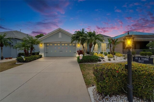 1102 Emerald Dunes Dr, Sun City Center, FL 33573 - ranch-style home with an attached garage, driveway, and stucco siding
