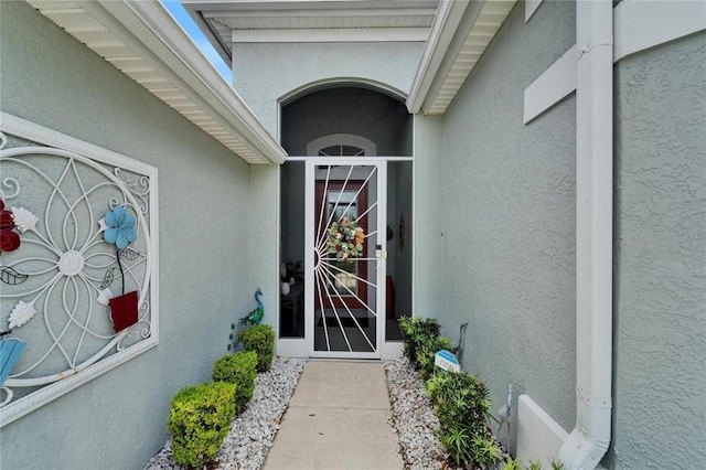 1102 Emerald Dunes Dr, Sun City Center, FL 33573 - view of exterior entry with stucco siding