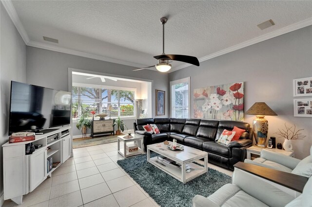 1102 Emerald Dunes Dr, Sun City Center, FL 33573 - living area featuring ornamental molding, light tile patterned floors, a textured ceiling, a ceiling fan, and visible vents