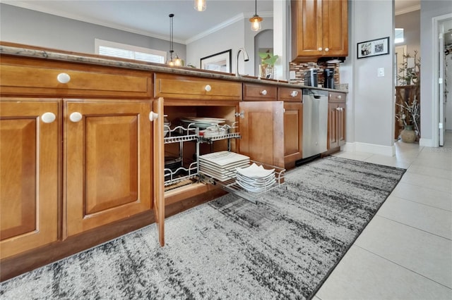 1102 Emerald Dunes Dr, Sun City Center, FL 33573 - kitchen with stainless steel dishwasher, light tile patterned floors, ornamental molding, brown cabinets, and baseboards