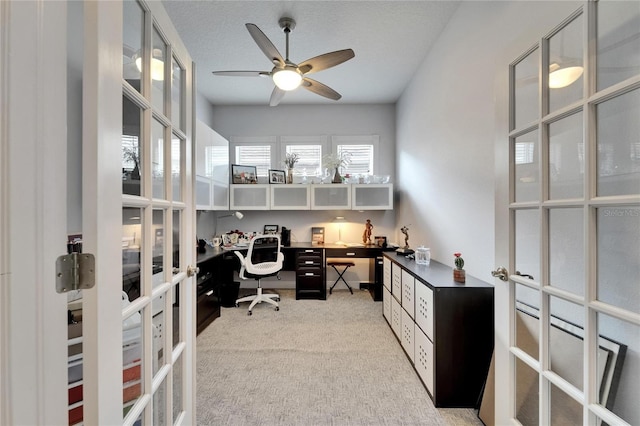1102 Emerald Dunes Dr, Sun City Center, FL 33573 - carpeted home office with french doors, a ceiling fan, and a textured ceiling