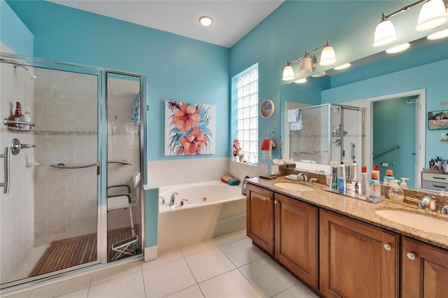 1102 Emerald Dunes Dr, Sun City Center, FL 33573 - bathroom featuring a sink, tile patterned flooring, a bath, and a stall shower