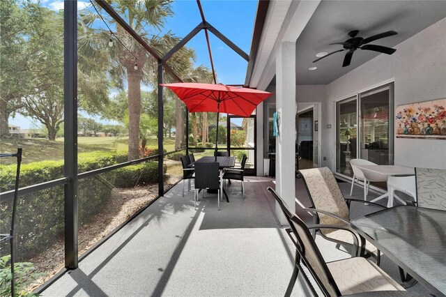 1102 Emerald Dunes Dr, Sun City Center, FL 33573 - sunroom featuring a ceiling fan and outdoor dining area