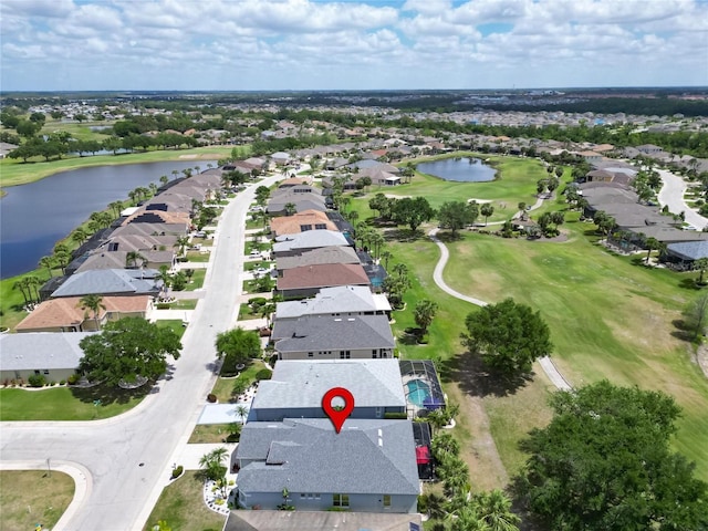 1102 Emerald Dunes Dr, Sun City Center, FL 33573 - bird's eye view featuring golf course view, a residential view, and a water view