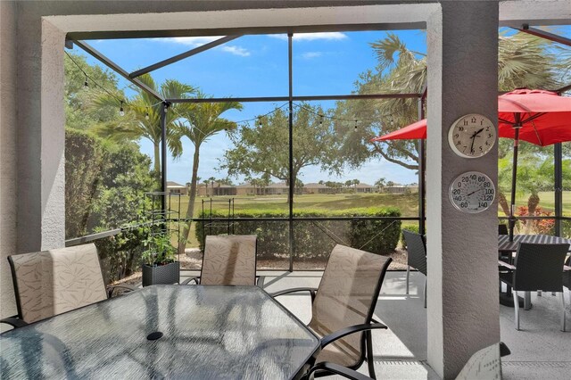 1102 Emerald Dunes Dr, Sun City Center, FL 33573 - sunroom / solarium with outdoor dining space