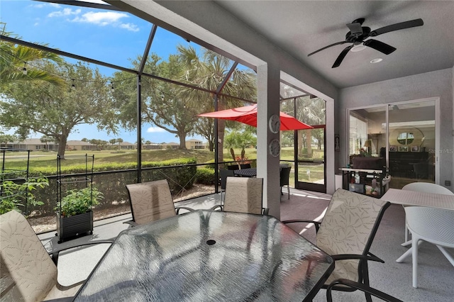 1102 Emerald Dunes Dr, Sun City Center, FL 33573 - sunroom featuring outdoor dining space and ceiling fan