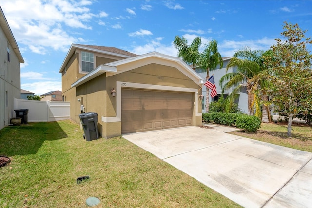 view of front of home featuring stucco siding, fence, a front lawn, an attached garage, and concrete driveway