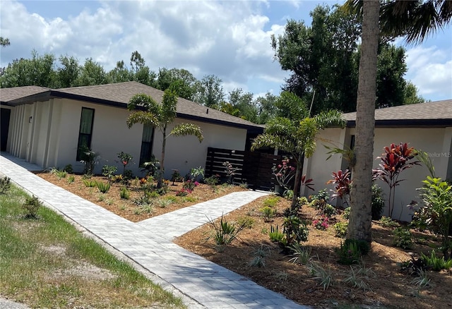 24549 Nova Ln, Punta Gorda, FL 33980 - view of side of property with stucco siding