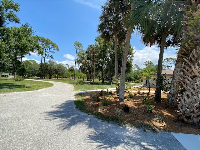 24549 Nova Ln, Punta Gorda, FL 33980 - surrounding community featuring a lawn