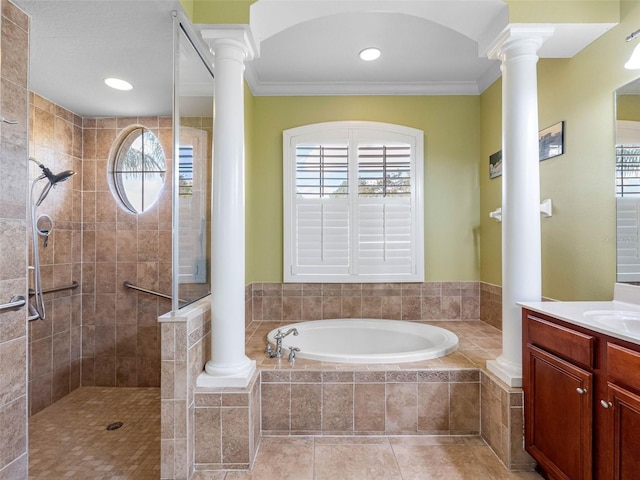 full bath with ornate columns, a garden tub, crown molding, and walk in shower