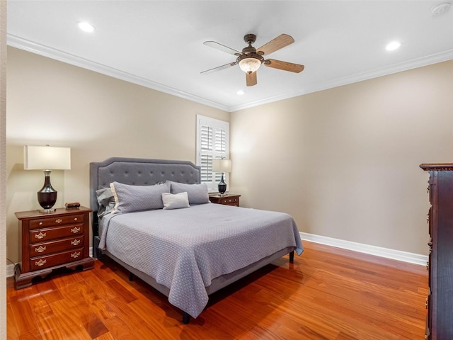 bedroom featuring baseboards, recessed lighting, wood finished floors, and ornamental molding