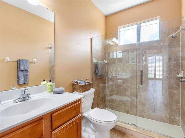 full bath featuring a tile shower, toilet, and vanity