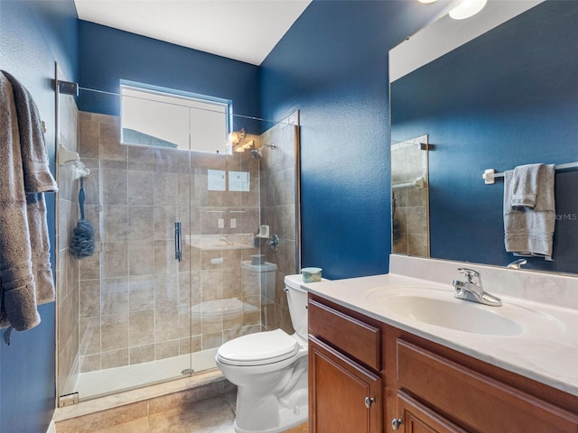 full bathroom featuring vanity, toilet, and a shower stall