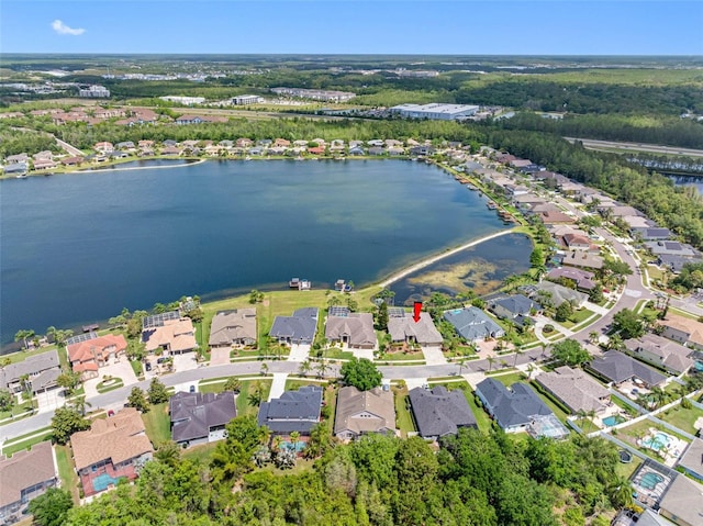 birds eye view of property with a residential view and a water view