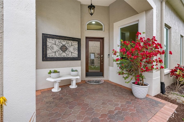 9897 Sago Point Dr, Seminole, FL 33777 - doorway to property featuring stucco siding
