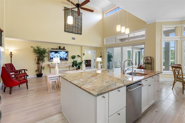 9897 Sago Point Dr, Seminole, FL 33777 - kitchen featuring light wood finished floors, ornamental molding, a ceiling fan, a sink, and stainless steel dishwasher