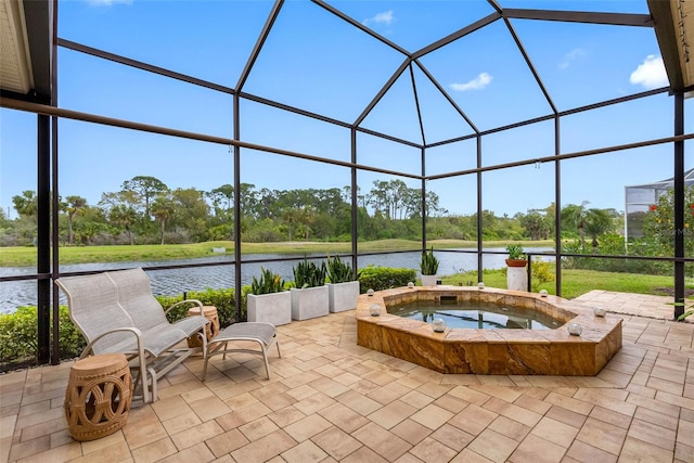 9897 Sago Point Dr, Seminole, FL 33777 - view of patio / terrace featuring an in ground hot tub, a lanai, and a water view