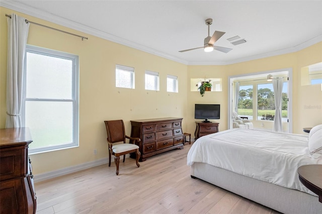 9897 Sago Point Dr, Seminole, FL 33777 - bedroom featuring light wood finished floors, baseboards, and ornamental molding