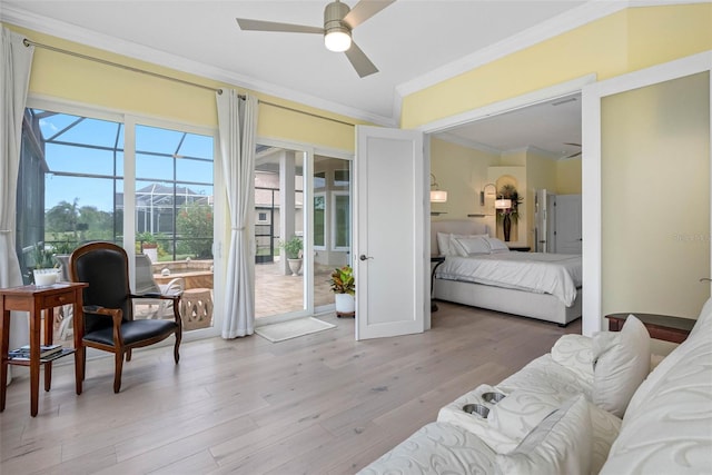 9897 Sago Point Dr, Seminole, FL 33777 - bedroom with a sunroom, ornamental molding, access to outside, and light wood-style flooring