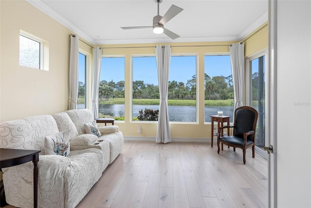 9897 Sago Point Dr, Seminole, FL 33777 - sunroom / solarium with a water view, ornamental molding, wood finished floors, and a healthy amount of sunlight