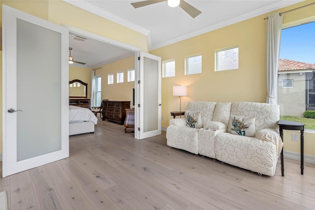 9897 Sago Point Dr, Seminole, FL 33777 - sitting room with a ceiling fan, ornamental molding, and wood finished floors