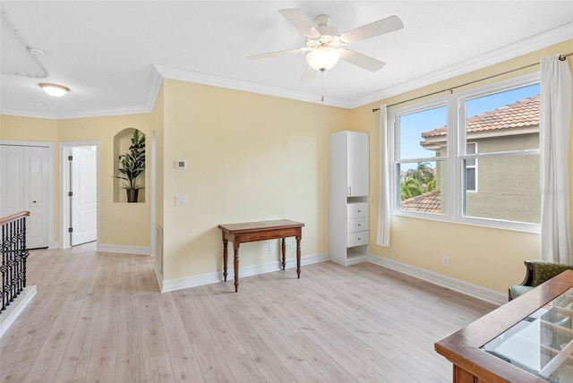 9897 Sago Point Dr, Seminole, FL 33777 - interior space featuring baseboards, crown molding, light wood-style floors, and ceiling fan