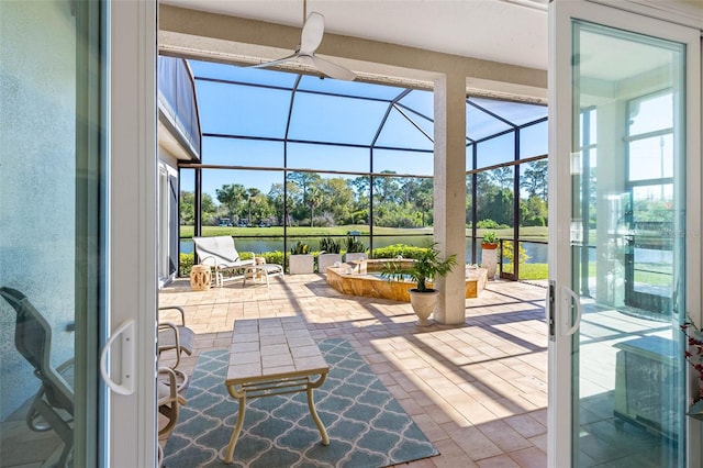 9897 Sago Point Dr, Seminole, FL 33777 - view of patio / terrace with a water view, ceiling fan, and a lanai