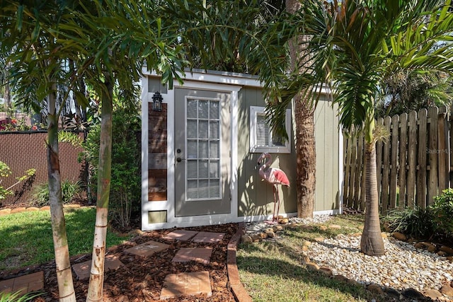 view of shed with fence