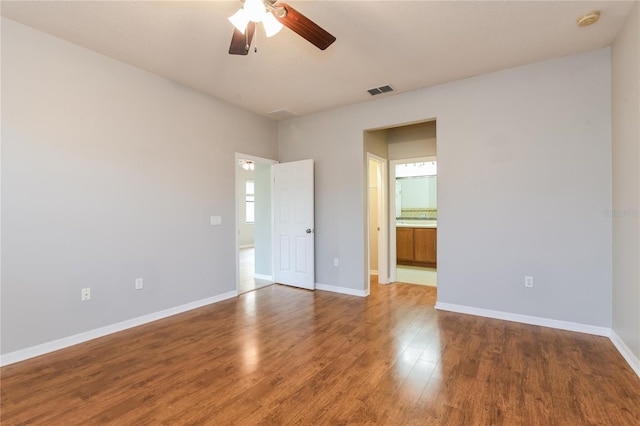 505 Millifiora Ln, Kissimmee, FL 34759 - unfurnished room featuring ceiling fan, wood finished floors, baseboards, and a smoke detector