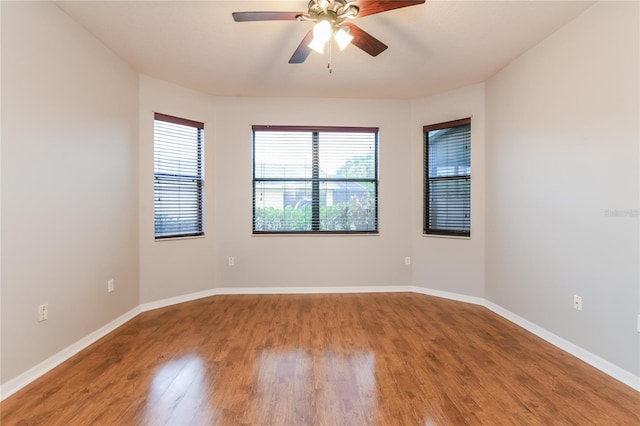 505 Millifiora Ln, Kissimmee, FL 34759 - unfurnished room featuring a ceiling fan, light wood finished floors, and baseboards