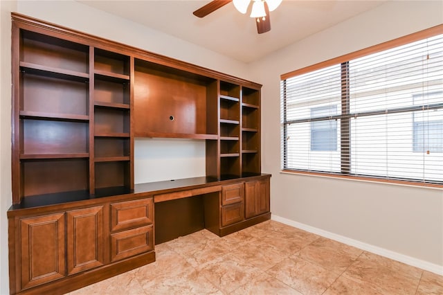 505 Millifiora Ln, Kissimmee, FL 34759 - unfurnished office featuring built in desk, ceiling fan, and baseboards