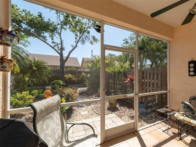 sunroom / solarium with ceiling fan
