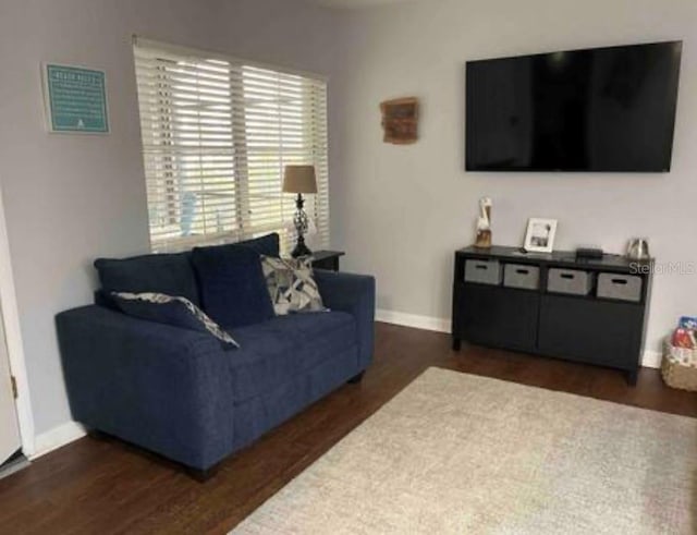 253 Rex Pl Unit B, Madeira Beach, FL 33708 - living area with wood finished floors and baseboards