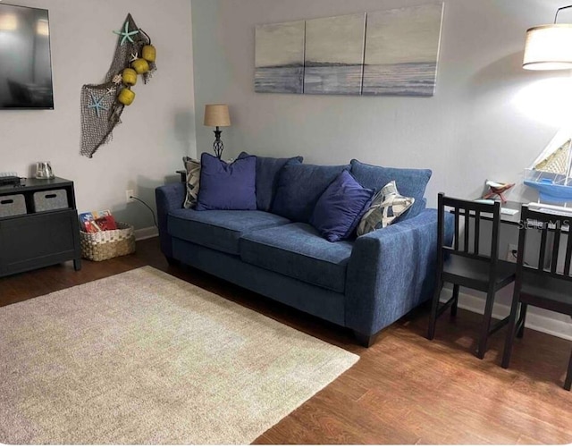 253 Rex Pl Unit B, Madeira Beach, FL 33708 - living room with wood finished floors and baseboards