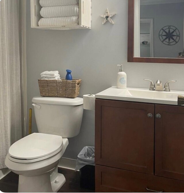 253 Rex Pl Unit B, Madeira Beach, FL 33708 - full bathroom with vanity, toilet, and wood finished floors