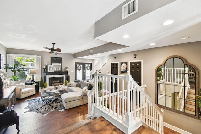 166 E Davis Blvd, Tampa, FL 33606 - living area featuring a ceiling fan, wood finished floors, a fireplace, and recessed lighting