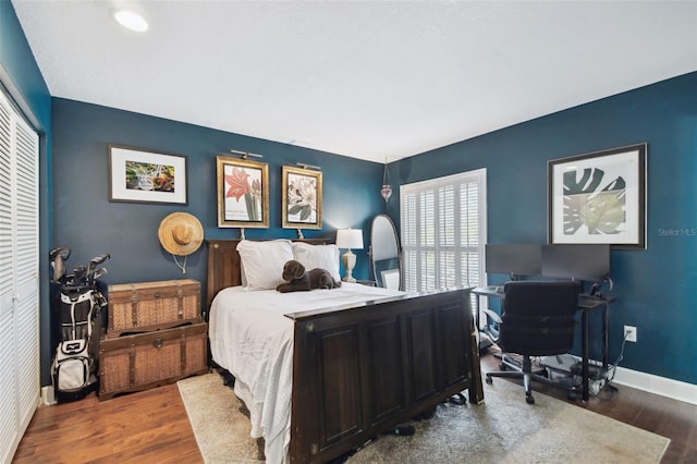 166 E Davis Blvd, Tampa, FL 33606 - bedroom featuring wood finished floors, a desk, baseboards, and a closet