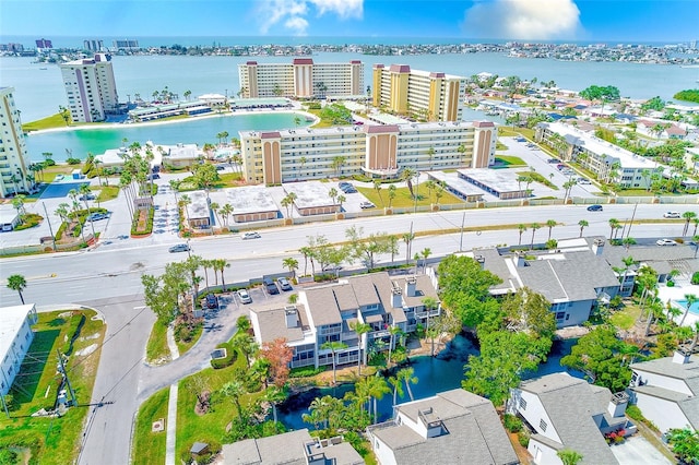birds eye view of property featuring a view of city and a water view