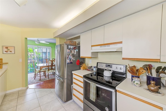 kitchen with under cabinet range hood, light countertops, white cabinets, and stainless steel appliances