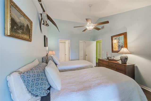 bedroom with baseboards, high vaulted ceiling, ceiling fan, and visible vents