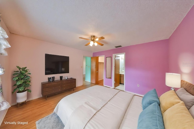 9210 Lehall Sq W, Lakeland, FL 33810 - bedroom featuring light wood finished floors, ensuite bath, and ceiling fan