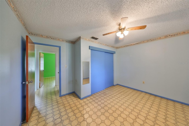 9210 Lehall Sq W, Lakeland, FL 33810 - unfurnished bedroom with a textured ceiling, a closet, baseboards, a ceiling fan, and light floors