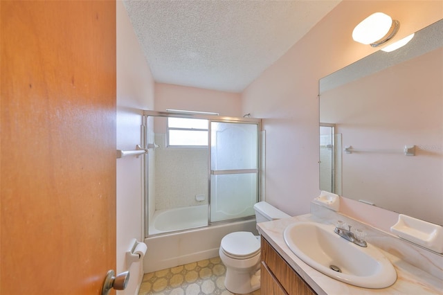 9210 Lehall Sq W, Lakeland, FL 33810 - bathroom featuring a textured ceiling, vanity, toilet, and bath / shower combo with glass door
