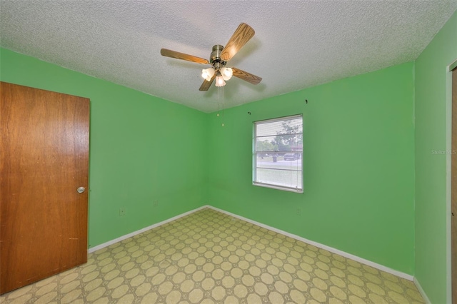 9210 Lehall Sq W, Lakeland, FL 33810 - empty room with ceiling fan, a textured ceiling, and baseboards