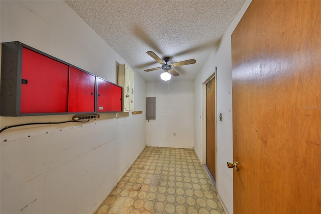 9210 Lehall Sq W, Lakeland, FL 33810 - corridor featuring a textured ceiling, light floors, and electric panel